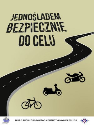 Napis Jednośladem bezpiecznie do celu na tle drogi