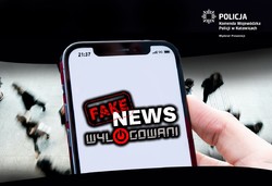 Wyświetlacz smartfona z napisem fake news wylogowani.