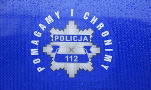 Napis pomagamy i chronimy Policja 112.